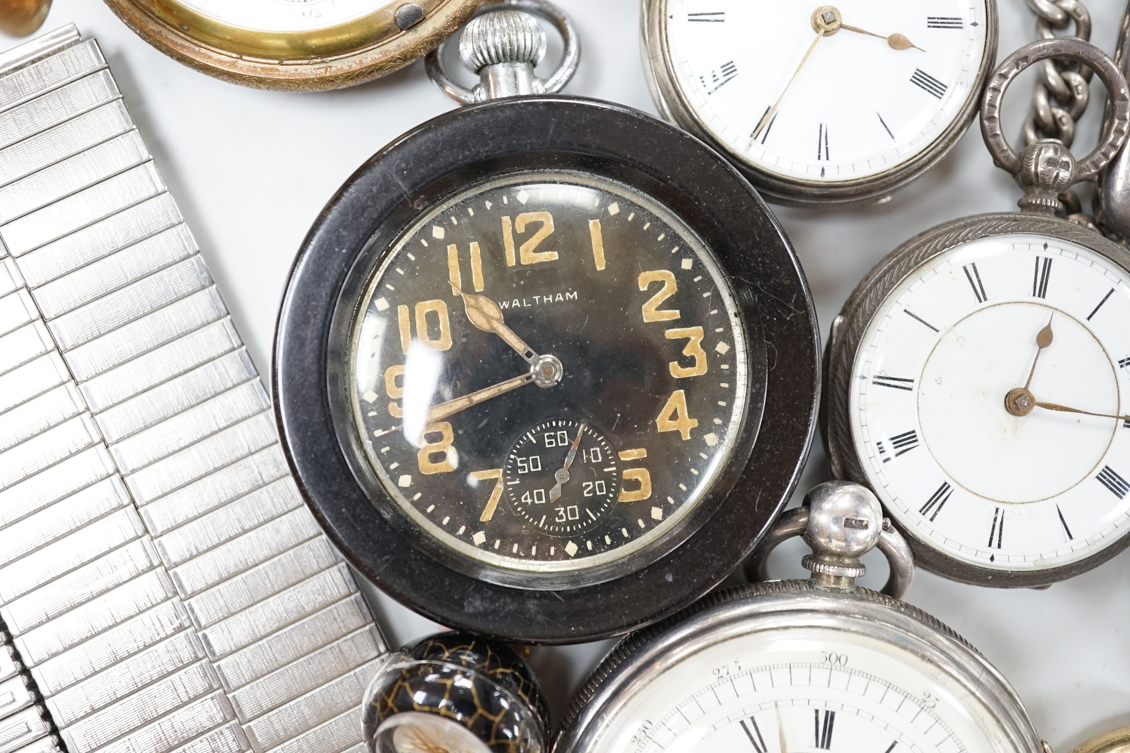 Twenty one assorted silver or base metal pocket watches including Waltham and Child of Birmingham, three wrist watches and a silver vesta case.